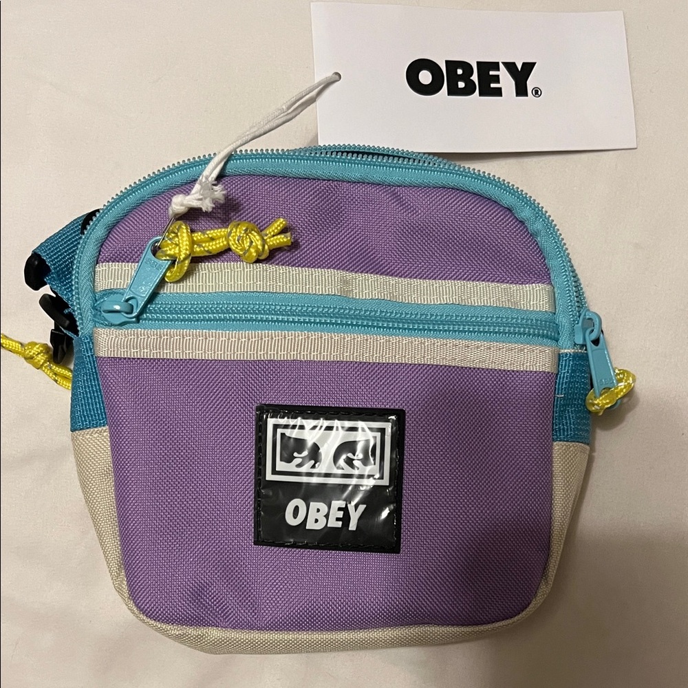 Obey Lavender Crossbody Pouch with Teal Trim and Yellow Pulls